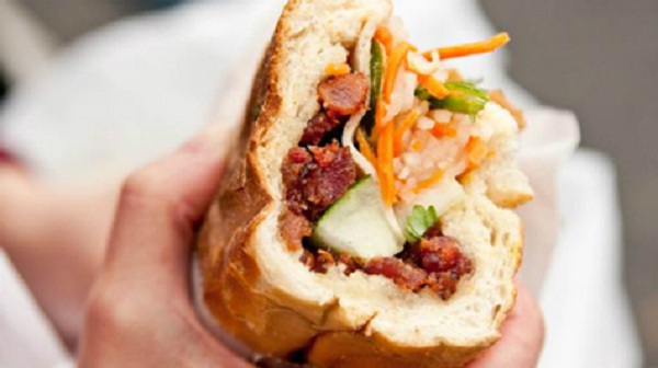 “Banh mi kep thit” with pork, some herbs, cucumbers, a little pepper