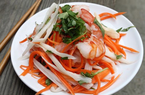 Vietnamese lotus root salad has colorful of carrot, lotus, celery…