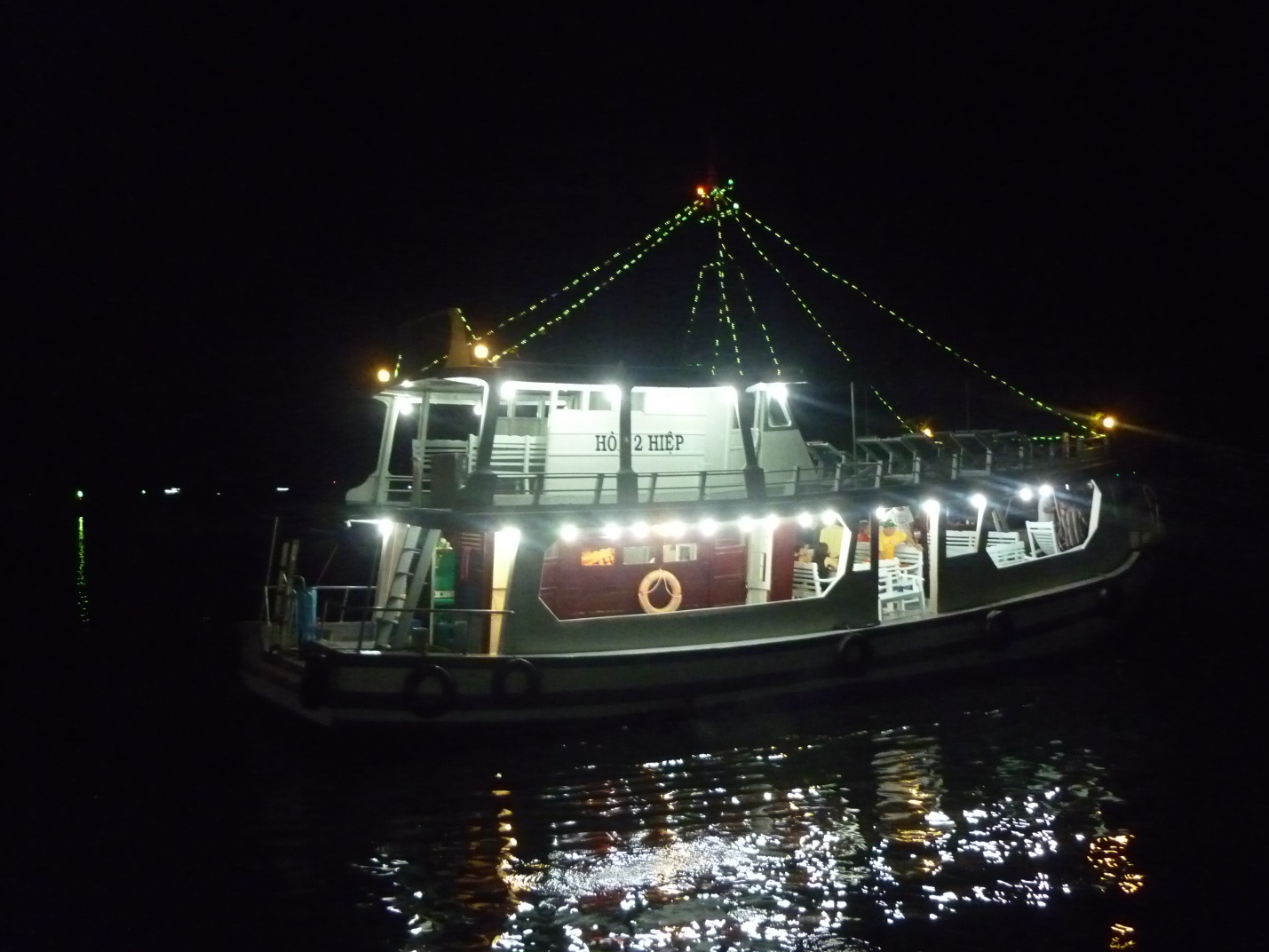 The boat which serves tourists to fish squids at night in Halong Bay