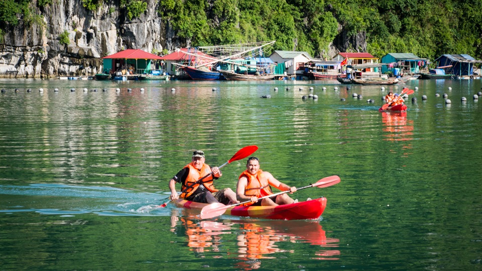 Kayak to visit floating villages in Halong Bay