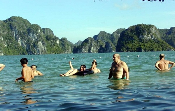 Tourists swimming in Halong Bay