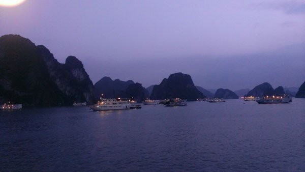 Sunset in Halong Bay – it’s time to prepare for squid fishing