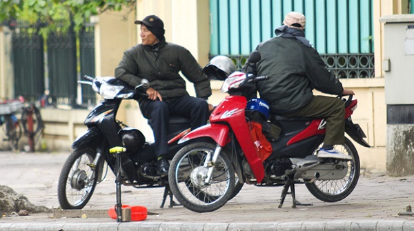 “Xe om” drivers appear every street in Vietnam