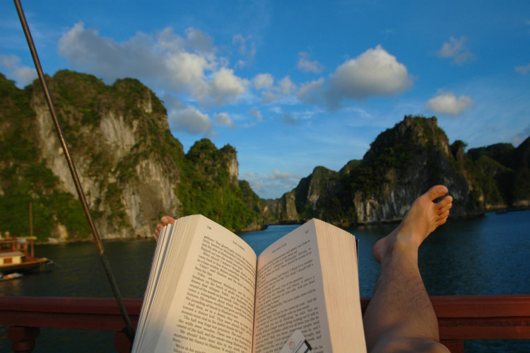 Reading book in Halong Bay